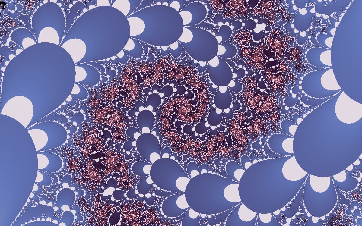 The Zaslavsky map: swirling arms and mandala-like rings in warm orange and gold